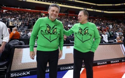 Tom Izzo and Greg Kampe wear matching Grinch sweaters on sideline