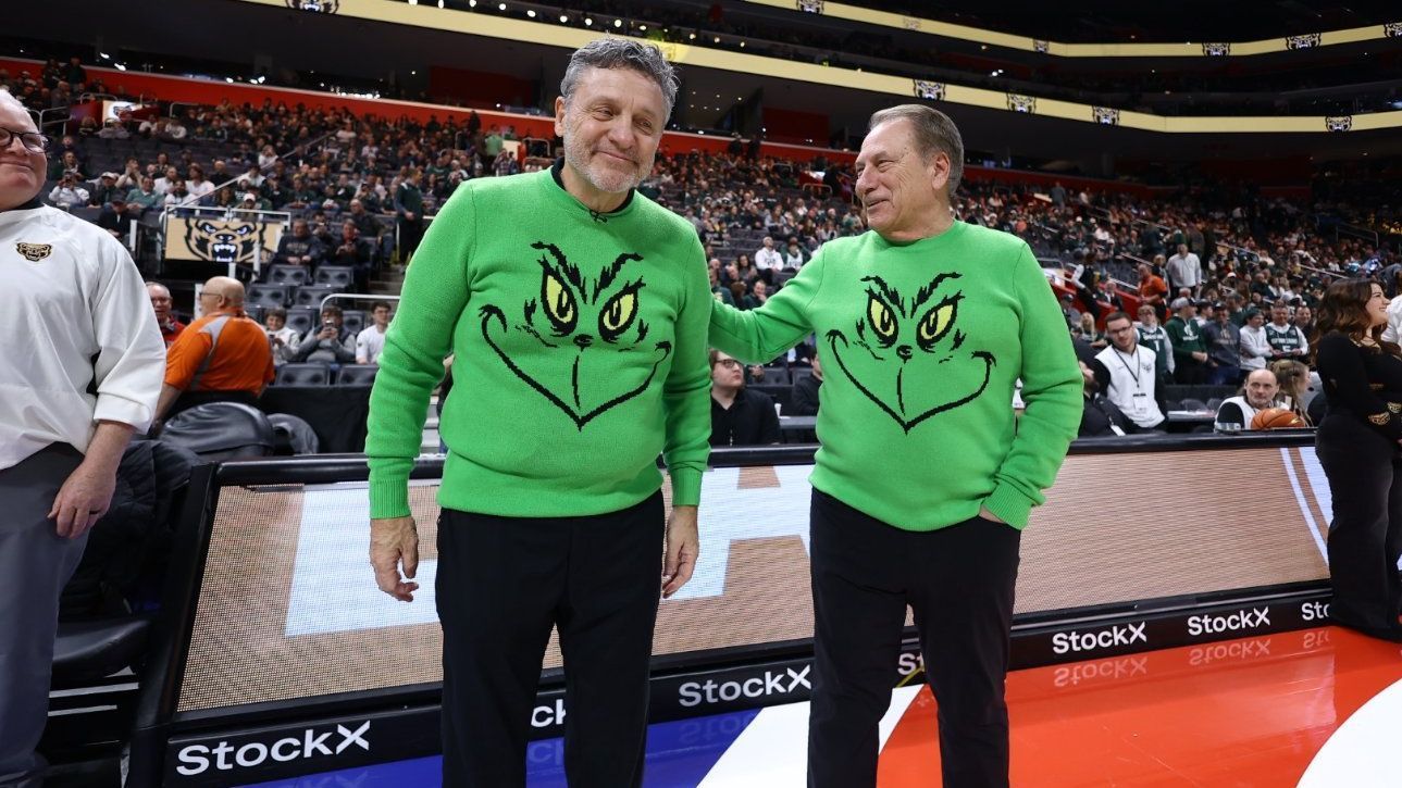 Tom Izzo and Greg Kampe wear matching Grinch sweaters on sideline